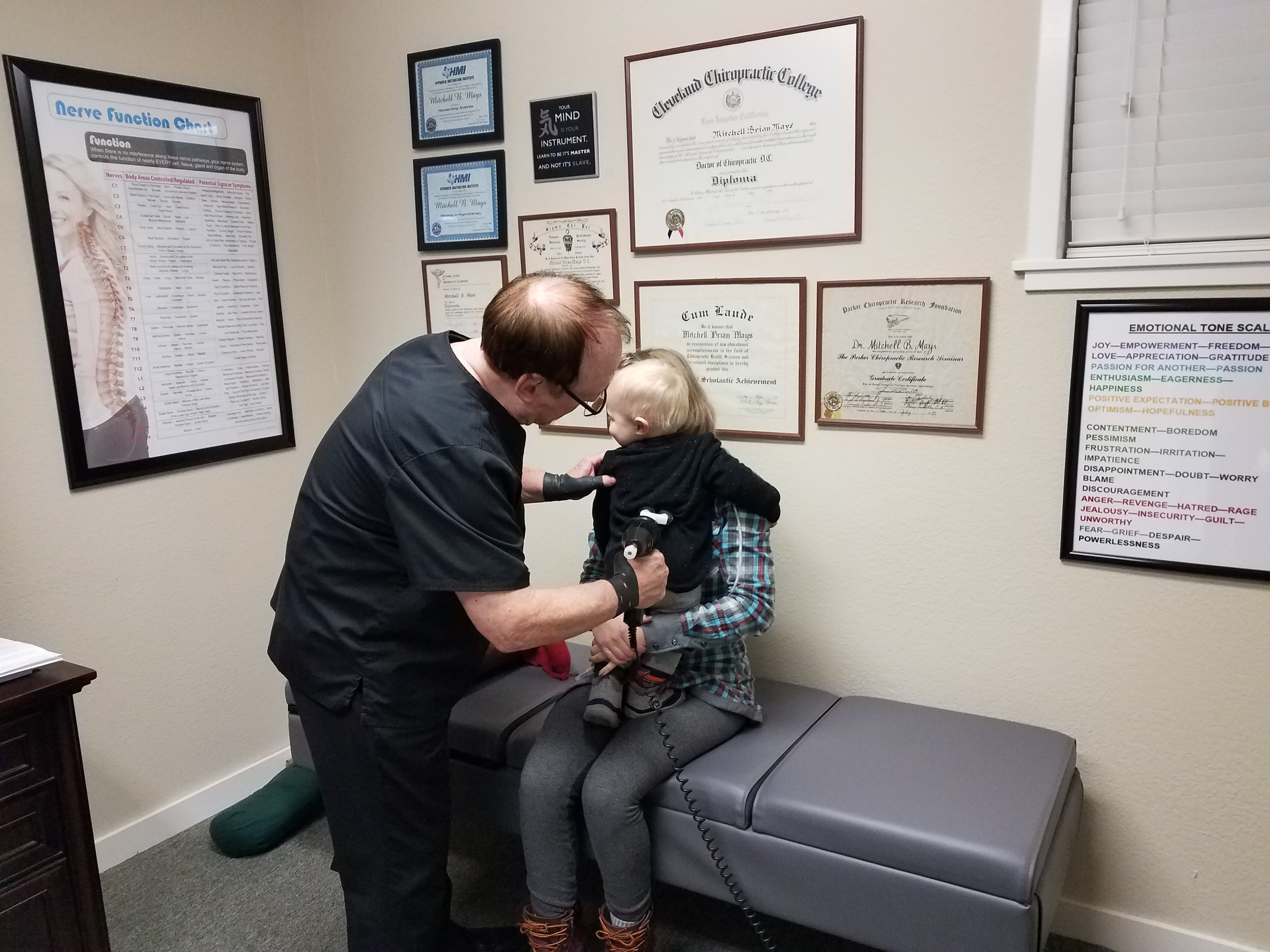 Dr. Mays adjusting pediatric patient